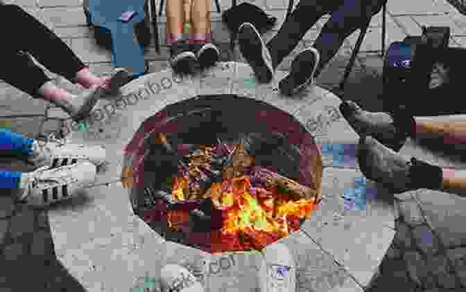 A Group Of Homeless People Gather Around A Fire, Sharing Food. Homeless DELUXE Giuliano Donati