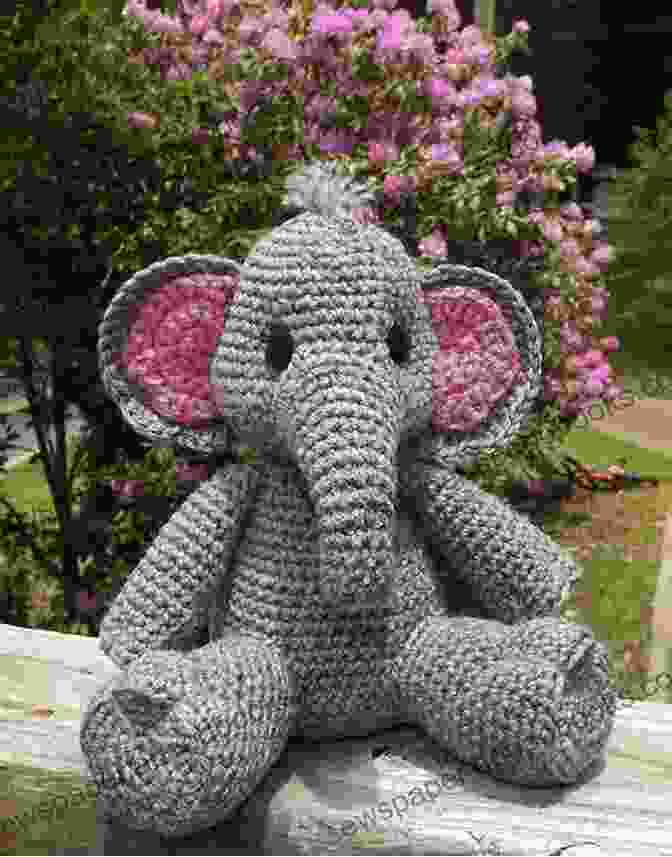 A Photo Of A Crocheted Parent And Baby Elephants Standing Side By Side. Amigurumi Parent And Baby Animals: Gorgeous Crocheting Toys For Babies Patterns