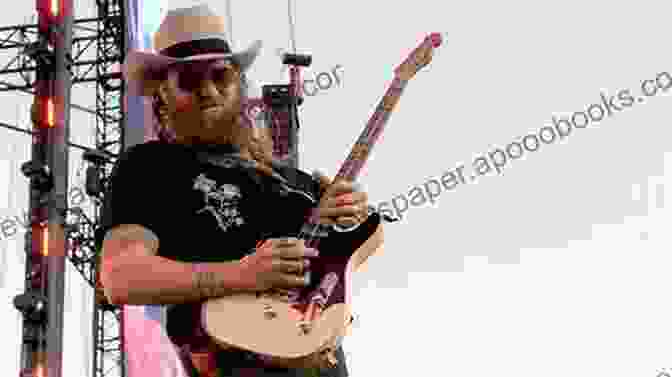 A Picture Of A Guitarist Playing A Country Guitar. Tapping Discovered: A Fresh Approach For Guitar Players Of Rock Metal Funk Country Fusion Styles