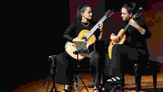 A Skilled Classical Guitarist Showcasing The Intricacies Of The Spanish Guitar Songs Of Spain Haekyung Um