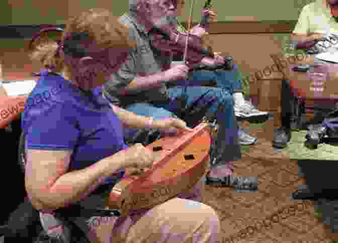 George Hutton Playing The Dulcimer With Delicate Precision, Surrounded By A Collection Of His Handcrafted Instruments. The Irish Dulcimer George Hutton