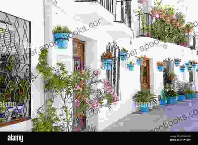 Picturesque Street In Santa Cruz With Whitewashed Houses And Flower Pots Seville Travel Guide: A Weekend In Seville (Spain Travel Guides)