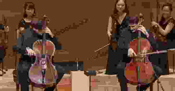 Two Cellists Performing A Duet On Stage Beautiful Music For Two String Instruments II For Two Cellos